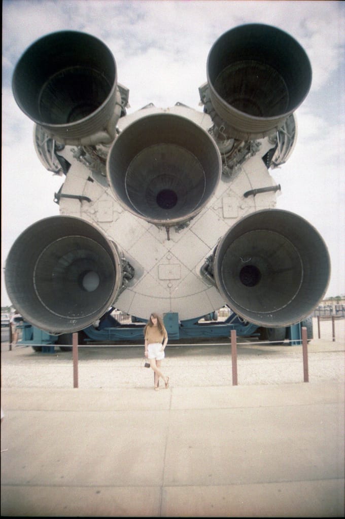 Saturn V F1 engines with Theresa for scale, Kennedy Space Center, Florida, 4 April 1991
